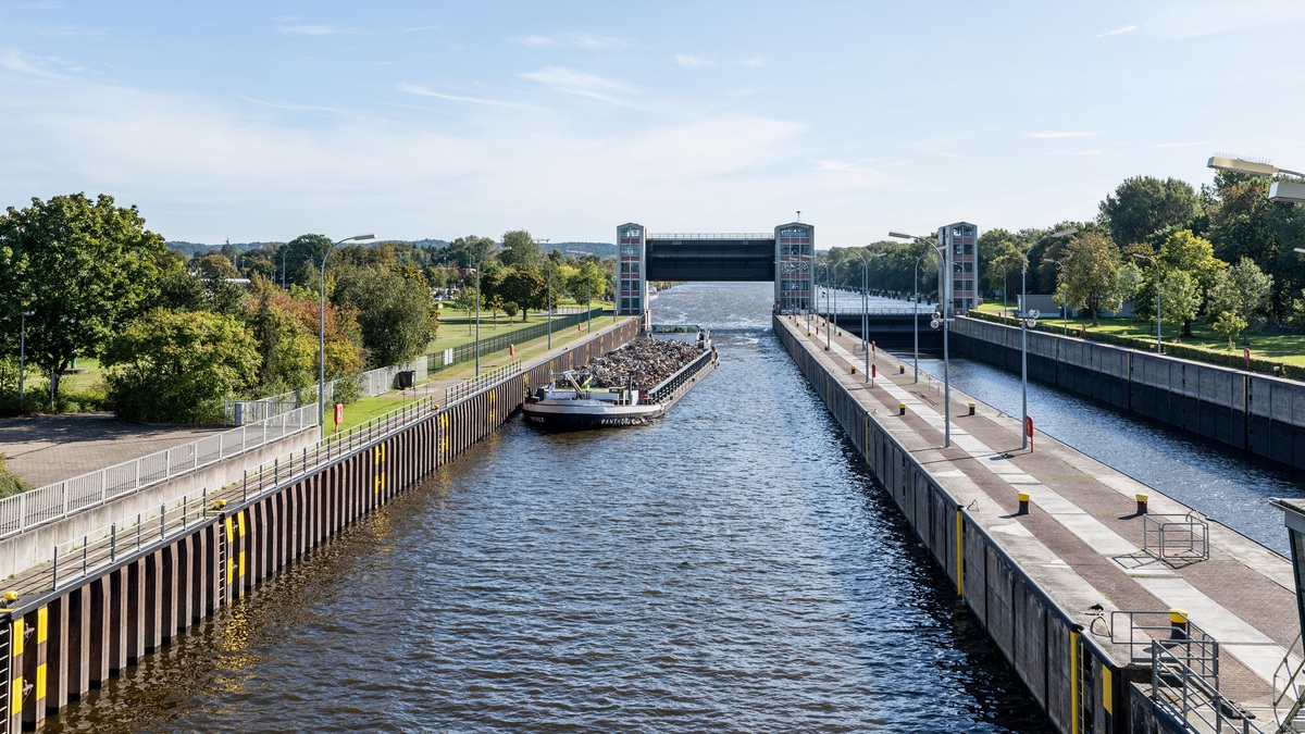 A barge passing through an inland canal lock