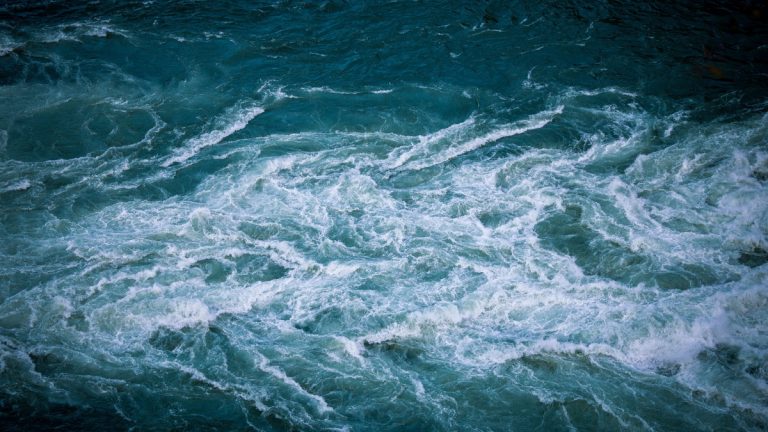 A powerful whirlpool churning in turquoise water