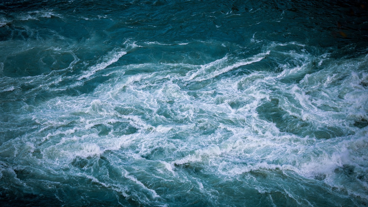A powerful whirlpool churning in turquoise water