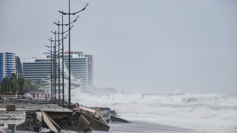 Storm waves striking a developed coastline