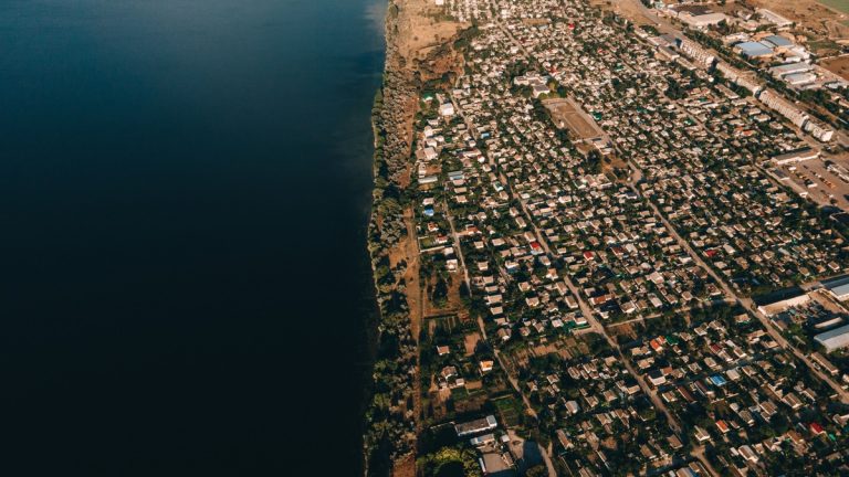 An aerial view of a coastal town and shoreline