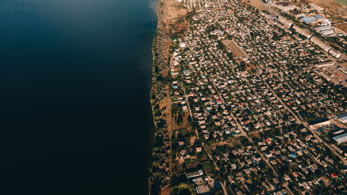 An aerial view of a coastal town and shoreline