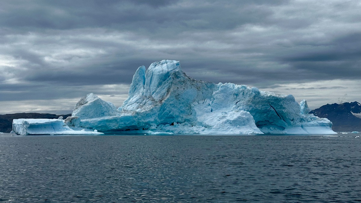 A large iceberg floating in Greenland waters