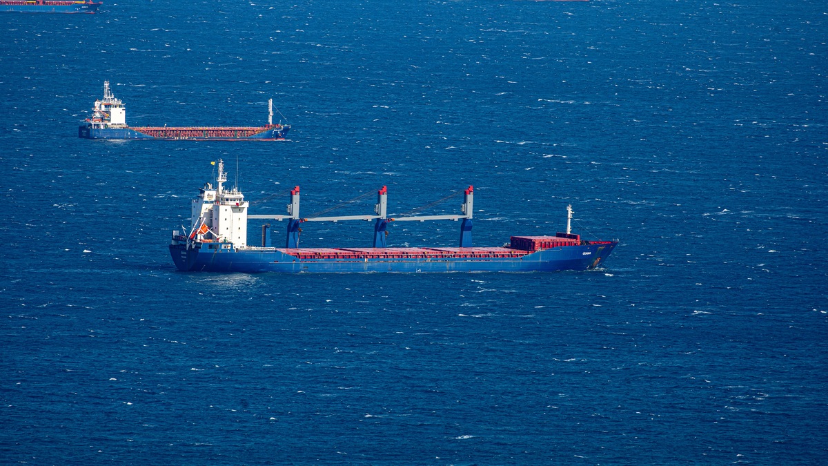 Cargo ships crossing the open ocean