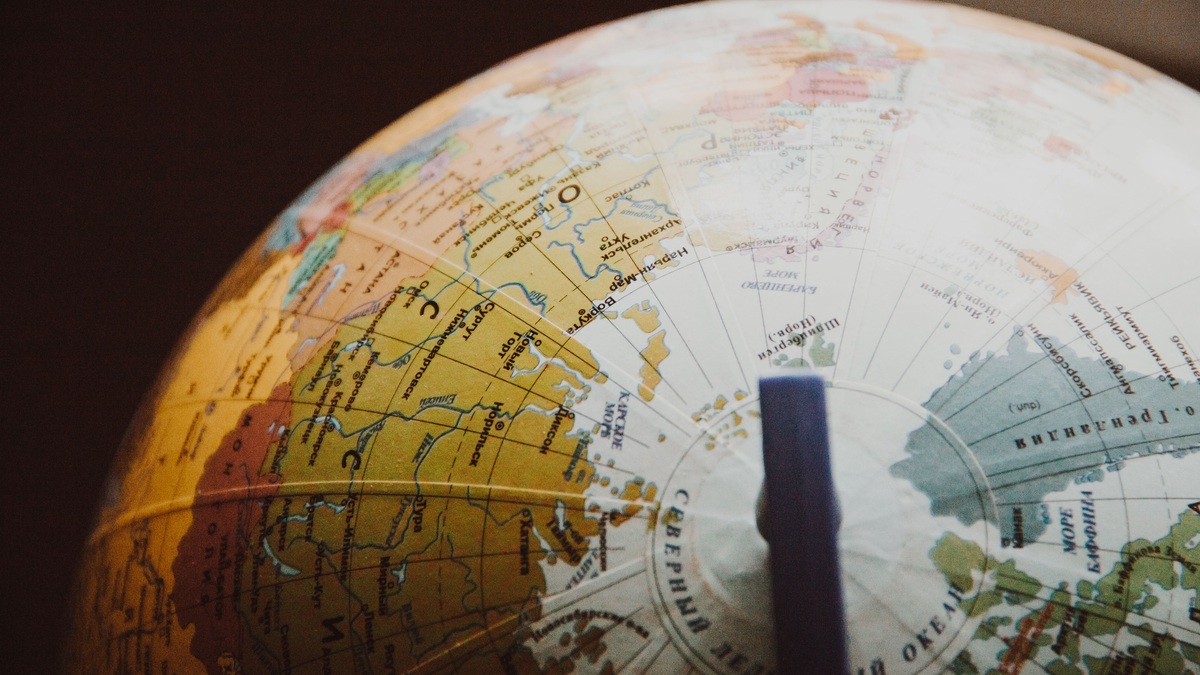 A globe marked with geographic coordinate lines
