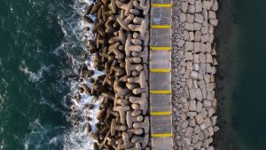 An armored seawall meeting ocean waves