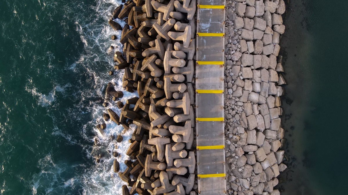 An armored seawall meeting ocean waves